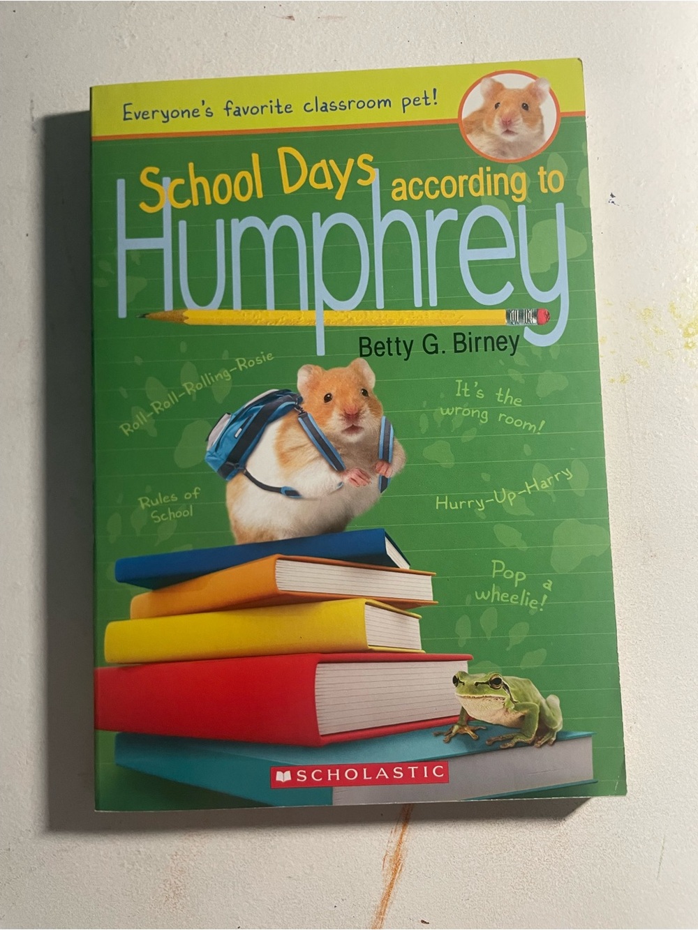 Scholastic Green Cover with Colorful Book Stack and Hamster